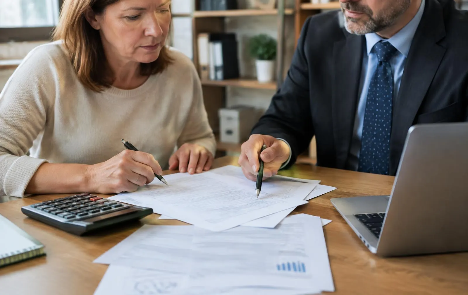 Property owner reviewing tax documents with an attorney