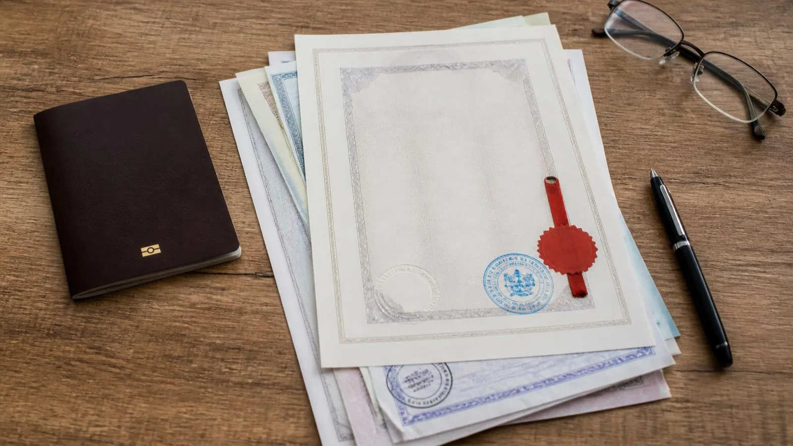Passport and apostilled documents prepared for a Costa Rican residency application