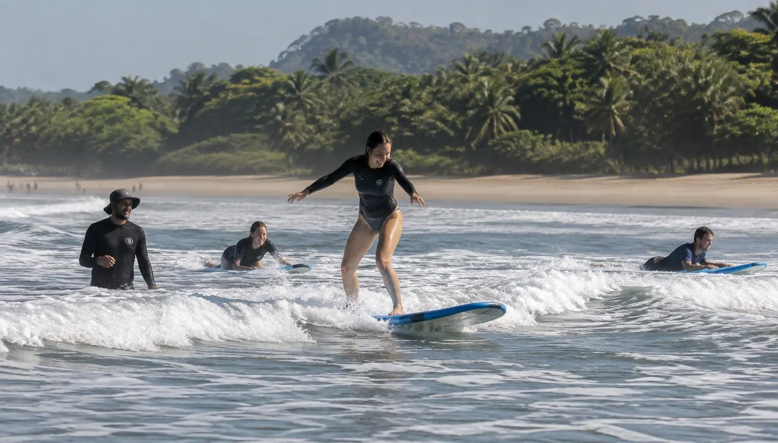 Beginner surfers in the whitewater at Playa Guiones, Nosara