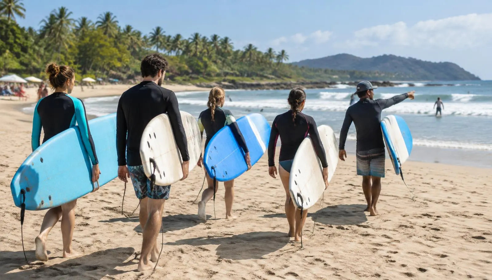 Surf school group carrying boards at Tamarindo beach